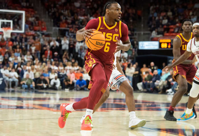 USC Trojans guard Bronny James dribbles the basketball to the rim.